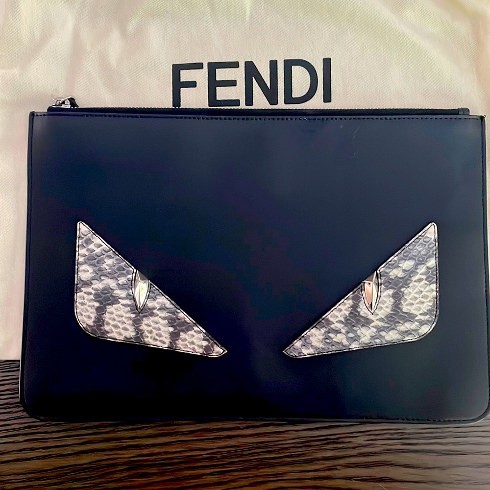 Fendi snake skin monster pouch. Used twice comes in dust bag.